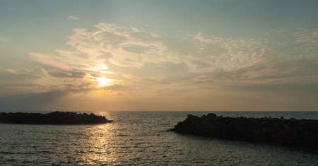 Scenic view of a sunset over the sea horizonの写真素材