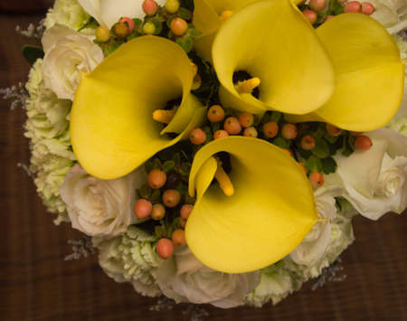 Bouquet of yellow lilies and rosesの写真素材