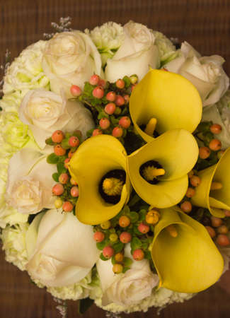 Bouquet of yellow lilies and rosesの写真素材