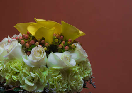 Bouquet of yellow lilies and rosesの写真素材
