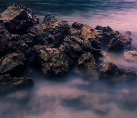 Rocks on a serene blue seaの写真素材