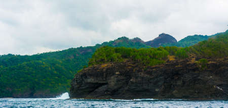 Rock Island over scenic blue sea water