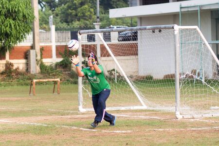 ayutthaya, thailand - 3 APR 2018 : Goalkeeper is receiving the ball at football matches In the chalk box closure activity of high school teachers in Bang Pa-in.のeditorial素材