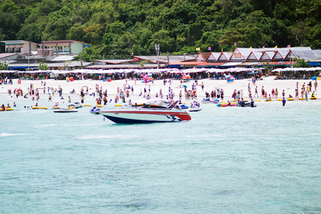 People are swimming and relaxing at the beach. On an islandのeditorial素材