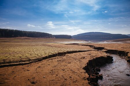 The bottom of the empty Studena dam near Pernik, Bulgaria. Hot weather and climate changes makes the dam almost empty. Climate disaster.の写真素材