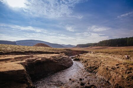 The bottom of the empty Studena dam near Pernik, Bulgaria. Hot weather and climate changes makes the dam almost empty.  Climate disaster.の写真素材