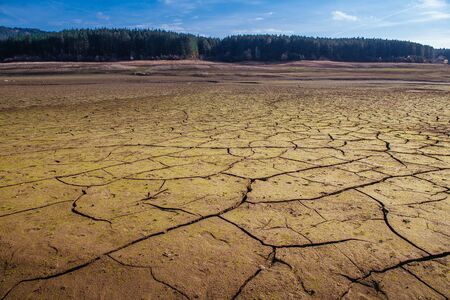 The bottom of the empty Studena dam near Pernik, Bulgaria. Hot weather and climate changes makes the dam almost empty.  Climate disaster.の写真素材
