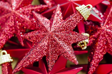 Close Up Photograph Of Shinny Red Christmas Stars