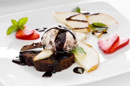 Photograph of a tasty dessert with chocolate cake ice cream and pearの写真素材