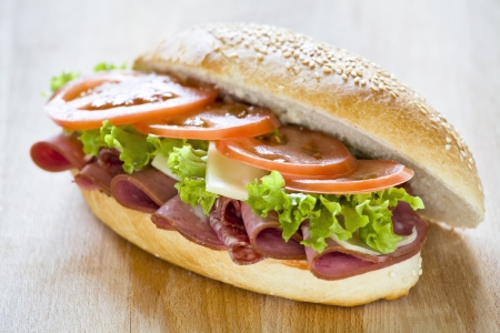 Photograph of a tasty mortadella and salami sandwichの写真素材