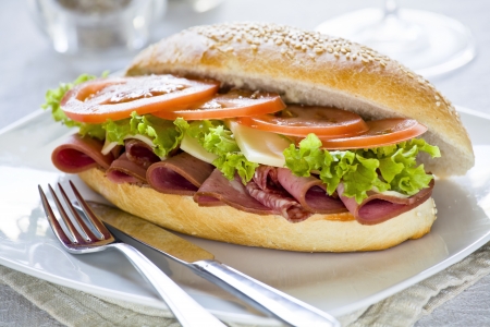 Photograph of a tasty mortadella and salami sandwichの写真素材