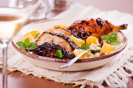 Photograph of a thai meal with barbecue chicken mango and riceの写真素材