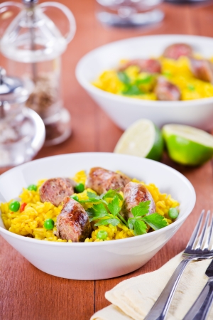 Close up photograph of a meal of indian food with sausages and spicesの写真素材
