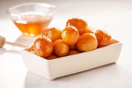 Bunch Of Homemade Greek Loukoumades Dough Balls With Honey