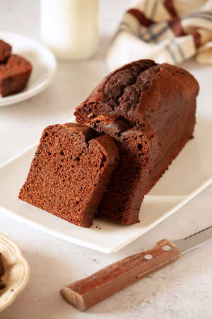 Slices of homemade dark chocolate cake on a platterの写真素材
