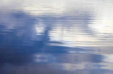 Detailed view on water surfaces at the baltic sea with waves and reflections on it