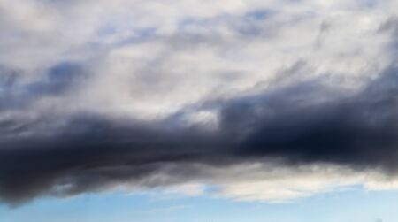 Stunning mixed cloud formations on a deep blue summer skyの写真素材