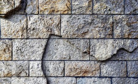 Detailed close up view on damaged bricks walls with cracks