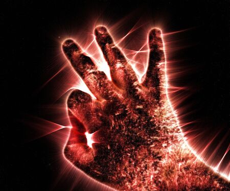 Kirlian aura photography of a glowing human male hand showing different symbols and show of handsの写真素材