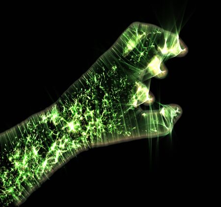 Glowing kirlian aura photography with green corona of a male human handの写真素材