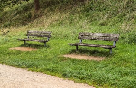 Isolated old bench in a landscape enviroment