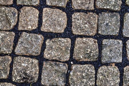 Detailed close up view on cobblestone street textures in high resolutionの写真素材
