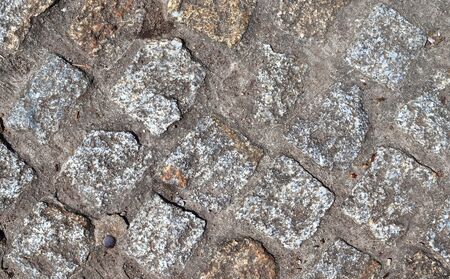 Detailed close up view on cobblestone street textures in high resolution