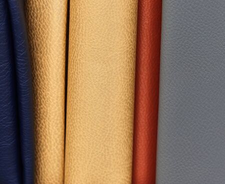 Close up view on colorful hanging and folded fabric textures and textiles in high resolution found...
