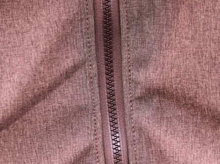 Close up view on colorful hanging and folded fabric textures and textiles in high resolution found on a fabrics marketの写真素材