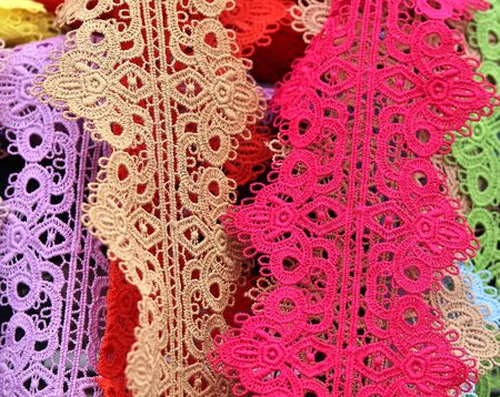 Close up view on colorful hanging and folded fabric textures and textiles in high resolution found...