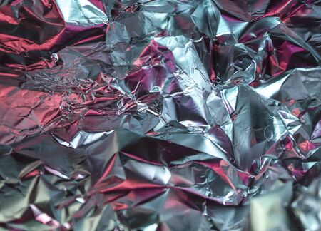 Detailed close up texture of an aluminum foil surface in different colors