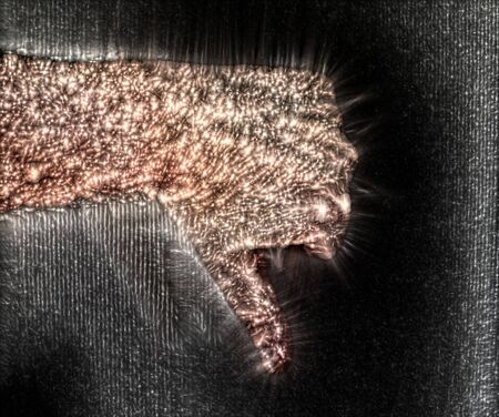 Photo of a glowing human male hand with a kirlian aura showing different symbols