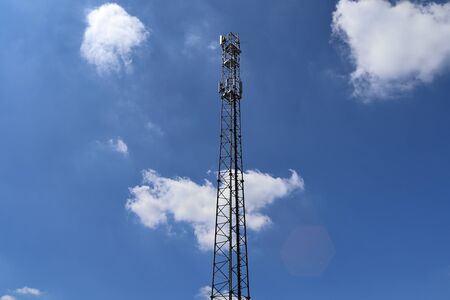 Close up view on a big power pylon transporting electricity in a countryside area