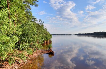 Beautiful view at a nothern german lake on a sunny day with nice blue water and relaxing landscapes