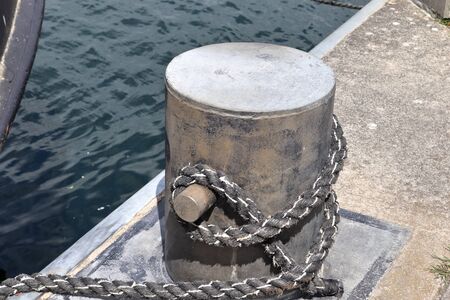 Aged and weathered bollard at the baltic sea port of Kiel in Germany