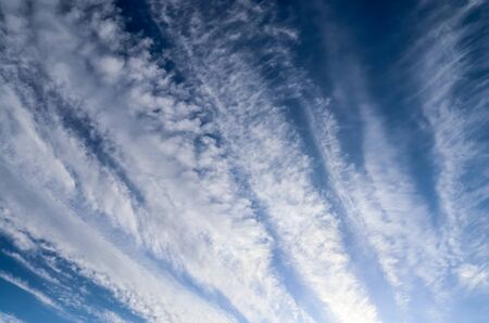 Stunning cirrus cloud formation panorama in a deep blue sky