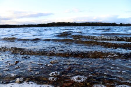 Close up on wild water waves on a stormy day