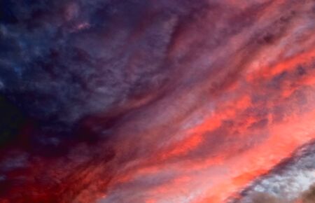 Beautiful panorama of orange and yellow cloudscapes at sunrise/sunset  on a blue sky in high...