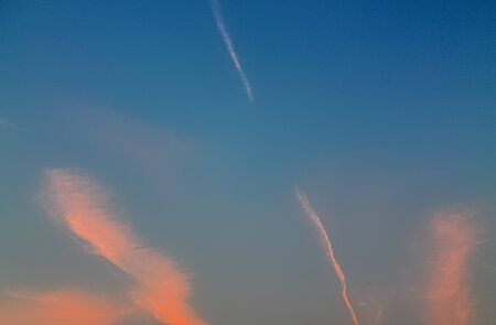 Beautiful panorama of orange and yellow cloudscapes at sunrise/sunset  on a blue sky in high...