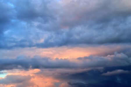 Panorama of orange and red sunset clouds in the sky