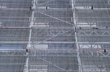 Scaffolding providing platforms for work in progress on a new apartment blockの写真素材