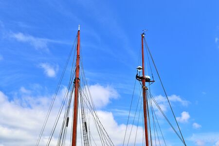 Old sailing shop mast and rope at the port of Kiel on a sunny day