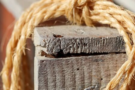 Old rope bound around an old vintage box in a close up view