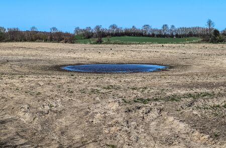 Detailed close up view on dry agricultural grounds and acre in high resolution showing dry farming fields and cracksの写真素材