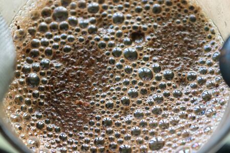 Close up view at a coffee surface in a cup.の写真素材