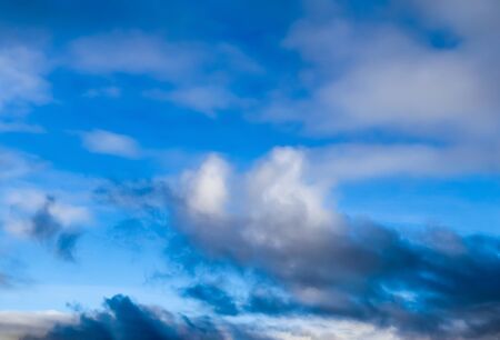 Stunning mixed cloud formation panorama in a deep blue summer sky.の写真素材