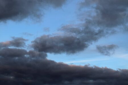 Stunning mixed cloud formation panorama in a deep blue summer sky.
