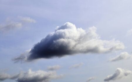 Stunning mixed cloud formation panorama in a deep blue summer sky.