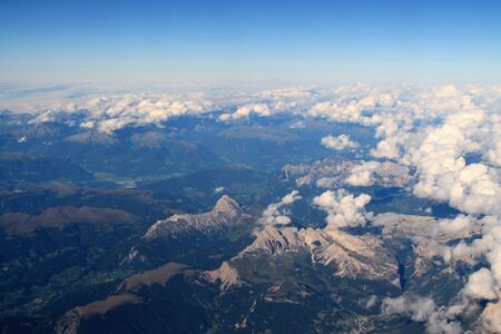 Stunning mixed cloud formation panorama in a deep blue summer sky.の写真素材