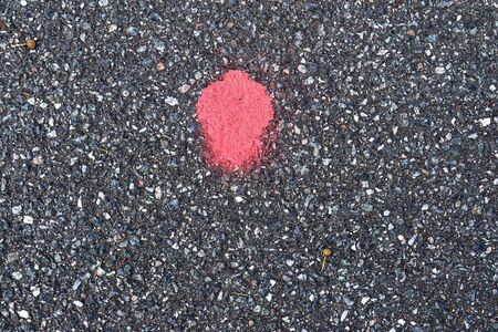 Detailed view on asphalt surfaces of different streets and roads with cracks in a close upの写真素材
